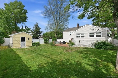 A charming expanded 3-bedroom, 2.5-bath split-level home located - photo 38