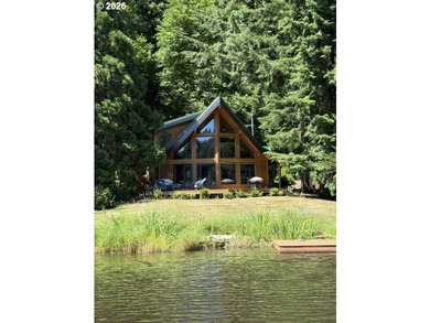 A Handcrafted Lakeside Haven Like No Other. This one-of-a-kind - photo 1