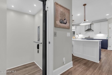 Coastal luxury meets low-maintenance living in this beautifully