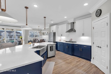 Coastal luxury meets low-maintenance living in this beautifully