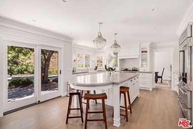 Nestled on a sprawling, park-like acre within the prestigious - photo 12