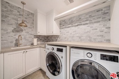 Nestled on a sprawling, park-like acre within the prestigious - photo 18