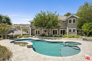 Nestled on a sprawling, park-like acre within the prestigious - photo 40