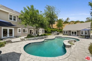 Nestled on a sprawling, park-like acre within the prestigious - photo 41
