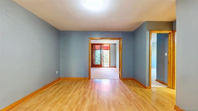 Experience easy living in the heart of Middle Village with this - photo 1