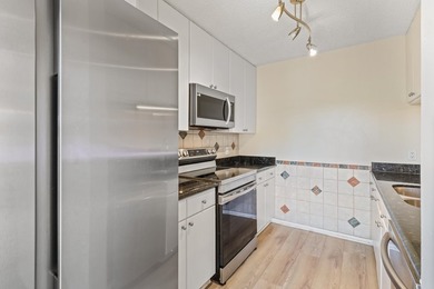 Welcome to this updated 2BR/2.5BA townhouse in the Village of - photo 6