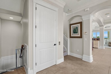 Perched on an oversized homesite in Hammock Beach, this 5,300 sq