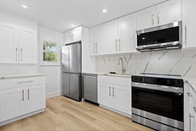 Welcome to Unit 109 at Boca House - a stunning, fully renovated - photo 3