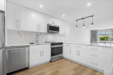 Welcome to Unit 109 at Boca House - a stunning, fully renovated - photo 4