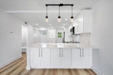 Welcome to Unit 109 at Boca House - a stunning, fully renovated - photo 5