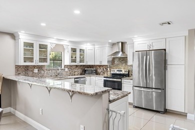 This beautifully remodeled 3-bedroom, 2-bathroom home offers - photo 15