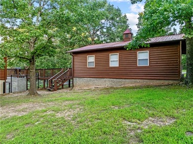 Nestled on nearly 1.5 acres comprised of six city lots, this log - photo 33
