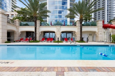 Experience the pinnacle of beachfront luxury with this - photo 1