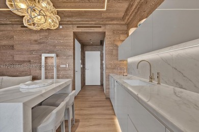 Experience the pinnacle of beachfront luxury with this - photo 9