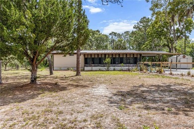 Welcome to this charming 3-bedroom, 2-bath nestled on 1.10 fully - photo 2