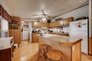 Enjoy lakefront living with this 3 bedroom, 2 bath home, sitting - photo 13