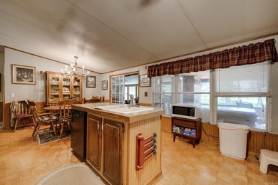 Enjoy lakefront living with this 3 bedroom, 2 bath home, sitting - photo 15