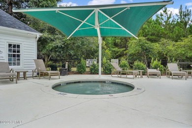 Tucked away on a quiet court within the gated Islands of - photo 16