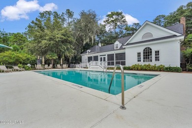 Tucked away on a quiet court within the gated Islands of - photo 17