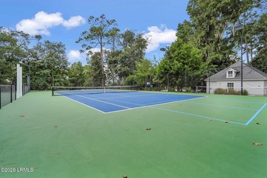 Tucked away on a quiet court within the gated Islands of - photo 18