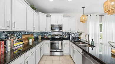 Welcome to 130 Mosaic Oaks Circle, an impeccable 3-bedroom, 2 - photo 12