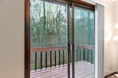 Tucked away on a peaceful cove of Lake Hiwassee in the - photo 43