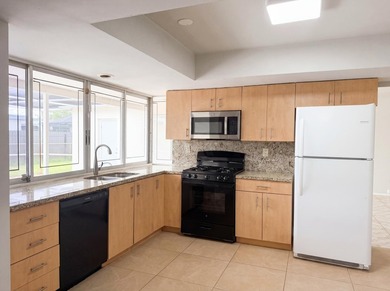 Experience 7141 Harbour Blvd, recently enhanced with fresh - photo 9