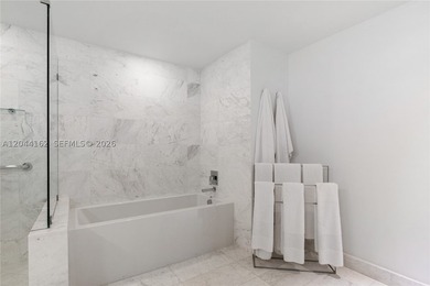Live in one of Miami's most coveted boutique buildings in the - photo 8