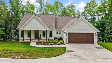 Lakefront home situated on over an acre in a serene wooded - photo 1