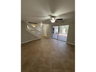 Welcome to this charming three-bedroom, three-bathroom townhouse - photo 9