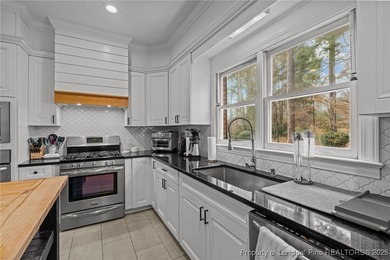 Welcome to this beautifully maintained traditional brick ranch