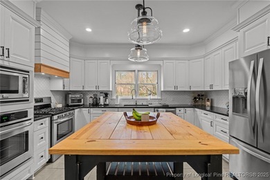 Welcome to this beautifully maintained traditional brick ranch