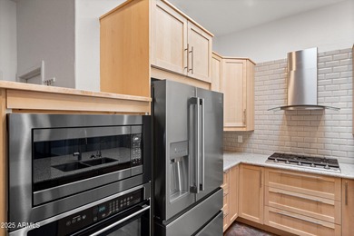 Welcome to this beautifully updated desert oasis featuring new