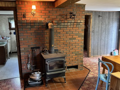 This solid Gambrel home sits on an open, level 1.2-acre lot with