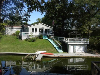 Warm and cozy waterfront home with an open feel located just off - Lake Home For Sale in Monon, Indiana