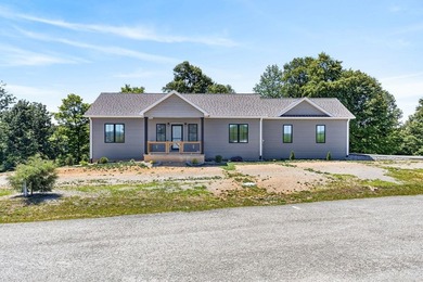 Lake living awaits in this beautiful 2024-built home located - photo 2