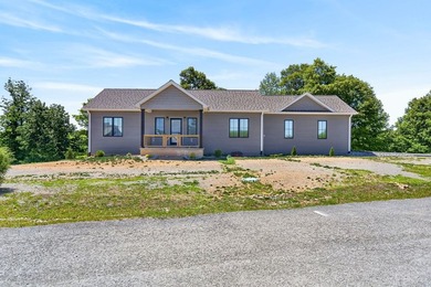 Lake living awaits in this beautiful 2024-built home located - photo 3