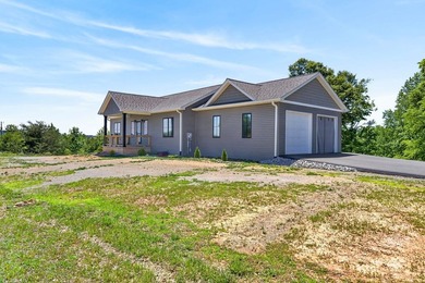 Lake living awaits in this beautiful 2024-built home located - photo 4