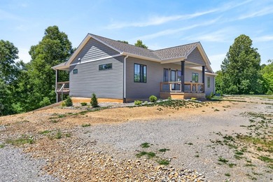Lake living awaits in this beautiful 2024-built home located - photo 5