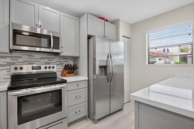 TASTEFULLY UPDATED END-UNIT VILLA WITH A BRAND NEW 2024 ROOF! - photo 3