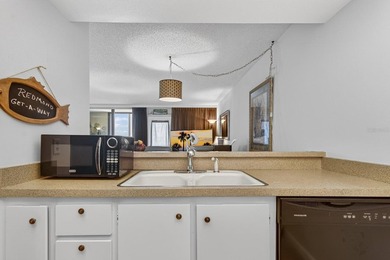 Welcome to Cove Cay, a premier gated waterfront community on - photo 11
