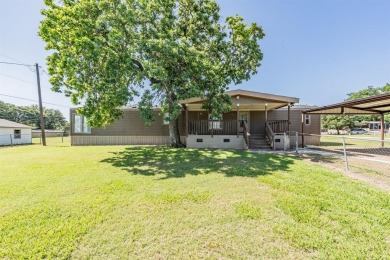 Lake Home For Sale in Pelican Bay, Texas