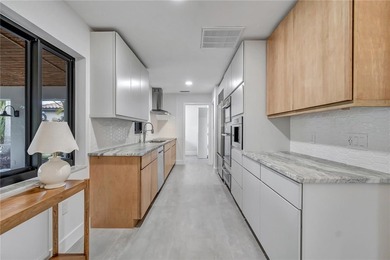 Experience resort-style living in this masterfully renovated - photo 5