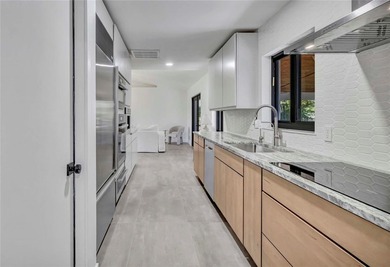 Experience resort-style living in this masterfully renovated - photo 10
