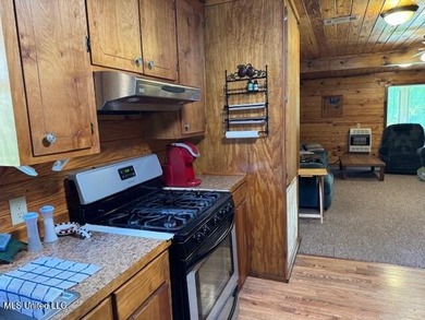 This camp house is a beautiful retreat nestled along the serene - photo 3