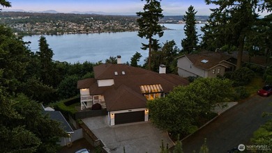 Perched above Lake Washington in one of the Island's most - photo 1