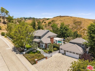 Nestled on a sprawling, park-like acre within the prestigious - photo 1