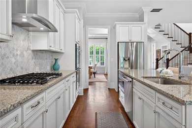 Nestled within the prestigious River District, a coveted gated - photo 23