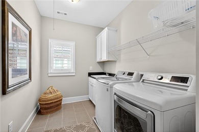Nestled within the prestigious River District, a coveted gated - photo 40