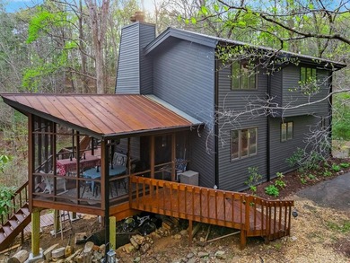 Tucked away on a peaceful cove of Lake Hiwassee in the - photo 3